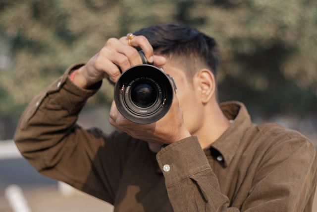 Person taking photos outdoors